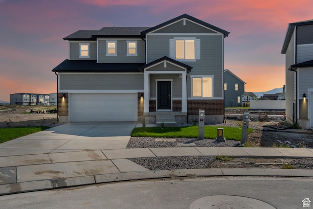 3523 N Browning St Unit 1233, Eagle Mountain, UT 84005 - view of front of property with brick siding, an attached garage, and concrete driveway
