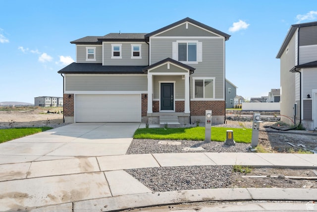 3523 N Browning St Unit 1233, Eagle Mountain, UT 84005 - view of front of home featuring brick siding, an attached garage, and driveway