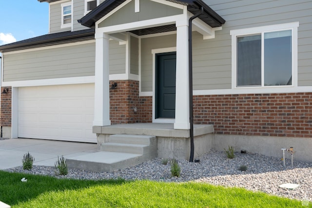3523 N Browning St Unit 1233, Eagle Mountain, UT 84005 - entrance to property featuring brick siding, a garage, and driveway