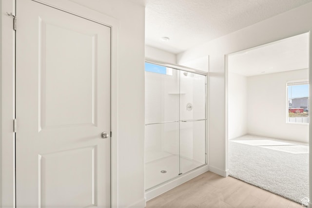 3523 N Browning St Unit 1233, Eagle Mountain, UT 84005 - bathroom featuring a stall shower and a textured ceiling