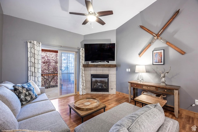 5501 Lillehammer Ln Unit 4306, Park City, UT 84098 - living room with ceiling fan, wood finished floors, vaulted ceiling, a tile fireplace, and baseboards