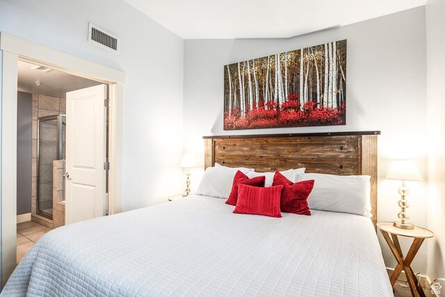5501 Lillehammer Ln Unit 4306, Park City, UT 84098 - bedroom with tile patterned floors, baseboards, and ensuite bath