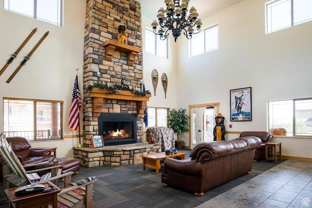 5501 Lillehammer Ln Unit 4306, Park City, UT 84098 - living area with a towering ceiling, a fireplace, a chandelier, healthy amount of natural light, and baseboards