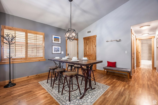 5501 Lillehammer Ln Unit 4306, Park City, UT 84098 - dining space featuring vaulted ceiling, wood finished floors, a chandelier, and baseboards