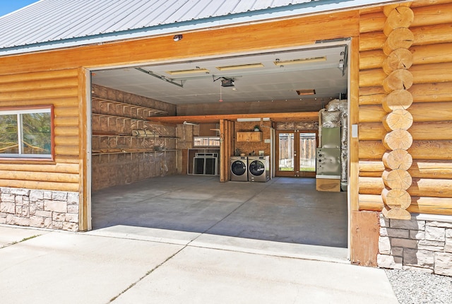garage with separate washer and dryer and french doors