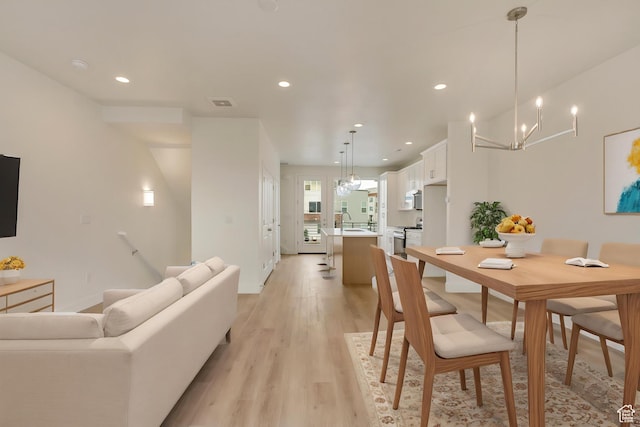 10627 S Pipestone Way W Unit 144, South Jordan, UT 84009 - dining room with recessed lighting, light wood-type flooring, baseboards, and a chandelier