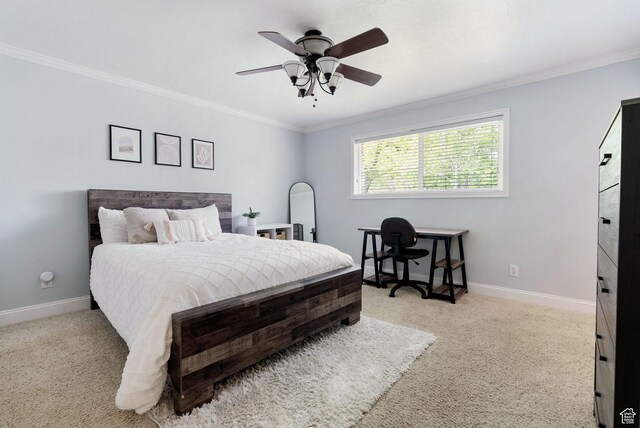 bedroom with ornamental molding, carpet floors, baseboards, and a ceiling fan