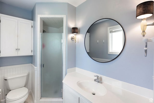full bath with a shower stall, toilet, tile patterned flooring, and vanity