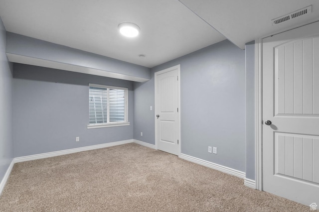 below grade area with carpet flooring and baseboards