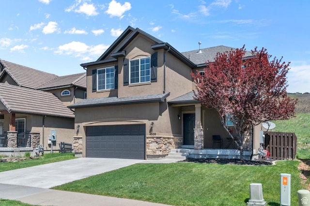 traditional-style home with stucco siding, an attached garage, stone siding, and driveway