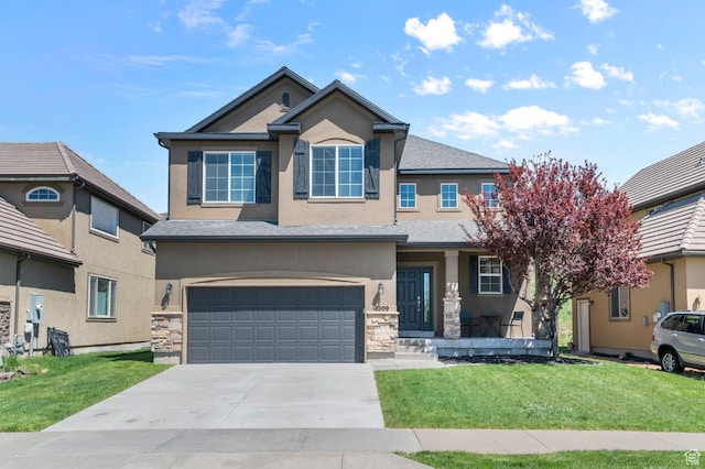 view of front of house featuring stucco siding, an attached garage, concrete driveway, and a front yard
