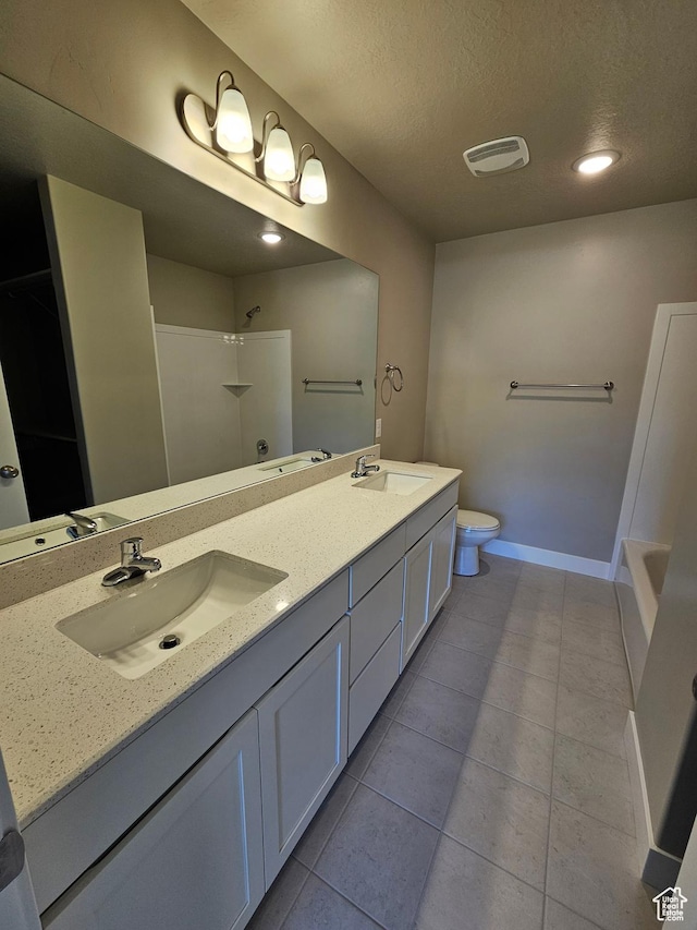 542 N 1400 W Lot 29, Springville, UT 84663 - bathroom with a shower, toilet, a textured ceiling, double vanity, and tile patterned flooring