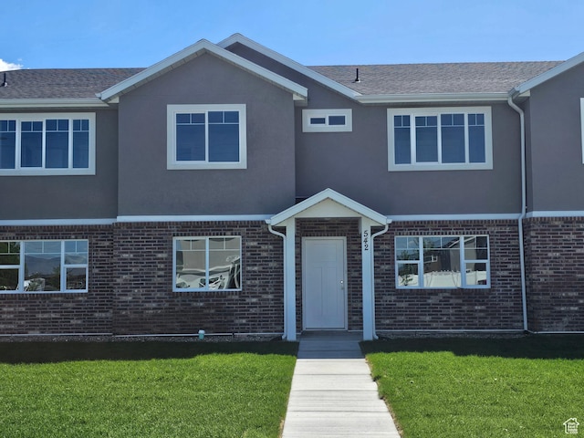 542 N 1400 W Lot 29, Springville, UT 84663 - view of front facade featuring brick siding, a front lawn, and stucco siding