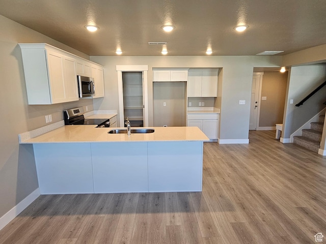 542 N 1400 W Lot 29, Springville, UT 84663 - kitchen featuring stainless steel appliances, a sink, a peninsula, light countertops, and baseboards