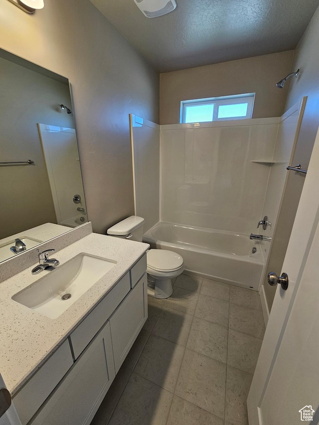 542 N 1400 W Lot 29, Springville, UT 84663 - bathroom with washtub / shower combination, toilet, vanity, a textured ceiling, and tile patterned floors