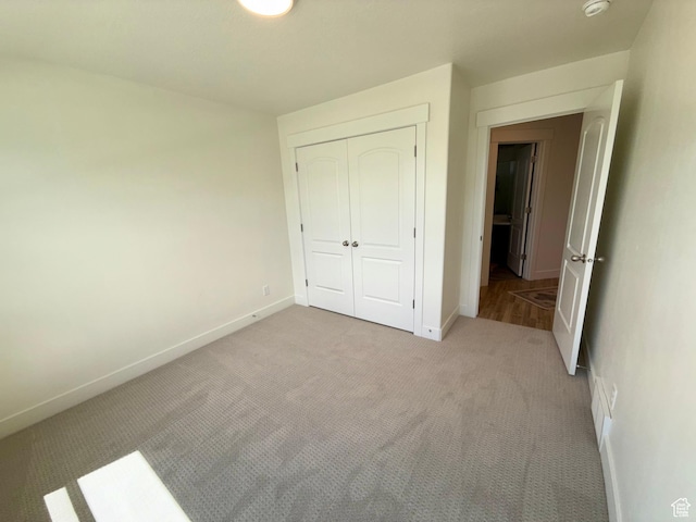 167 E Craner Peak Dr, Eagle Mountain, UT 84005 - unfurnished bedroom with baseboards, a closet, and carpet