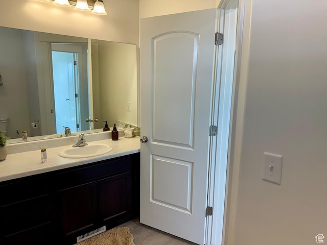167 E Craner Peak Dr, Eagle Mountain, UT 84005 - bathroom featuring vanity and wood finished floors