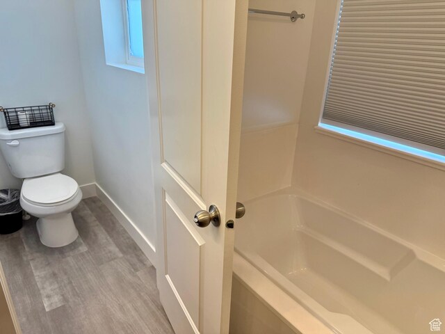 167 E Craner Peak Dr, Eagle Mountain, UT 84005 - full bath with toilet, a bathtub, baseboards, and wood finished floors