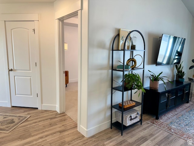167 E Craner Peak Dr, Eagle Mountain, UT 84005 - hallway featuring light wood-type flooring and baseboards