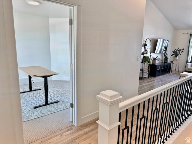 167 E Craner Peak Dr, Eagle Mountain, UT 84005 - hallway with wood finished floors, an upstairs landing, and baseboards