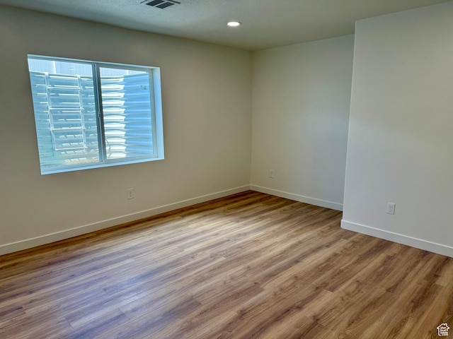 167 E Craner Peak Dr, Eagle Mountain, UT 84005 - empty room with wood finished floors, baseboards, and recessed lighting