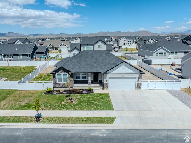 167 E Craner Peak Dr, Eagle Mountain, UT 84005 - view of front of house with a residential view, stone siding, a garage, and driveway
