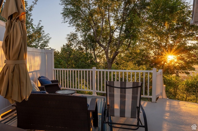 patio terrace at dusk featuring outdoor dining area
