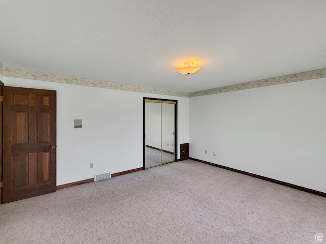 1145 E 1675 N, North Ogden, UT 84404 - carpeted spare room featuring baseboards and a textured ceiling
