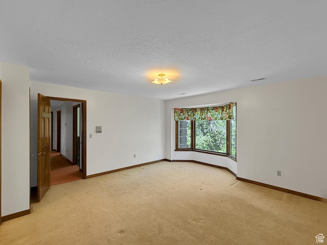 1145 E 1675 N, North Ogden, UT 84404 - empty room with light carpet, a textured ceiling, and baseboards