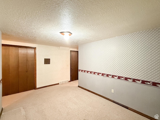 1145 E 1675 N, North Ogden, UT 84404 - carpeted spare room with a textured ceiling, baseboards, wallpapered walls, and electric panel