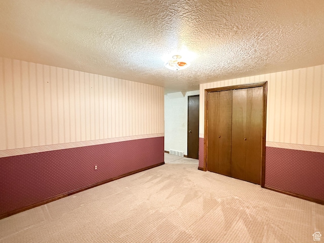 1145 E 1675 N, North Ogden, UT 84404 - unfurnished bedroom with a closet, carpet floors, a textured ceiling, and wood walls