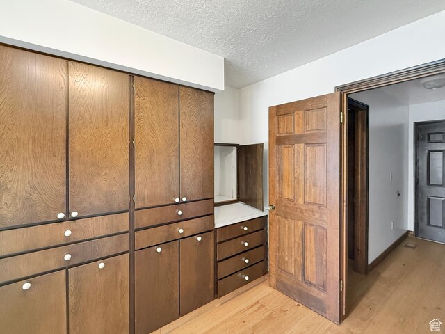 1145 E 1675 N, North Ogden, UT 84404 - interior space with light wood-style floors and a textured ceiling