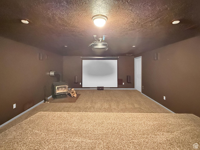 1145 E 1675 N, North Ogden, UT 84404 - carpeted cinema room with a wood stove, baseboards, a textured ceiling, and recessed lighting