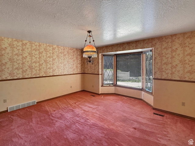 1145 E 1675 N, North Ogden, UT 84404 - carpeted spare room featuring wallpapered walls, baseboards, and a textured ceiling