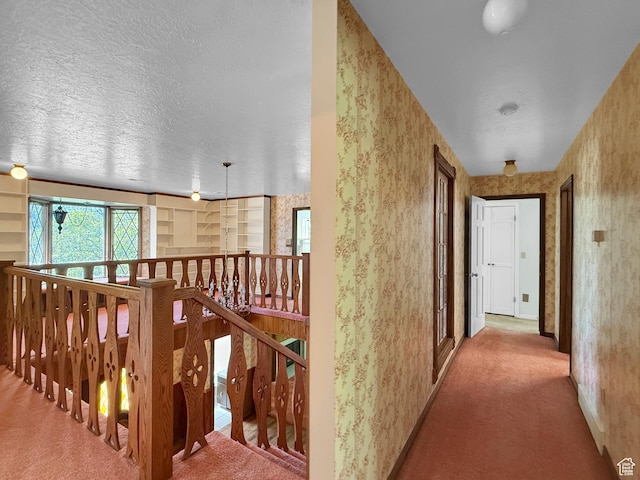 1145 E 1675 N, North Ogden, UT 84404 - hall featuring carpet, an upstairs landing, a textured ceiling, wallpapered walls, and baseboards