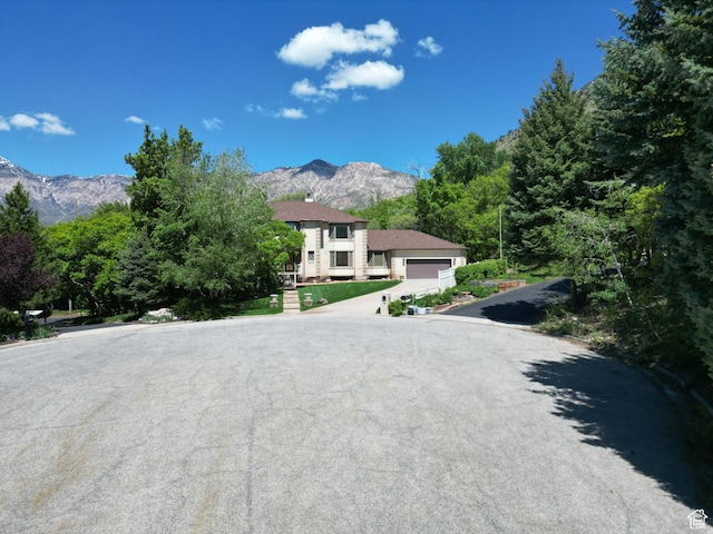 1145 E 1675 N, North Ogden, UT 84404 - view of front facade featuring a mountain view and a garage