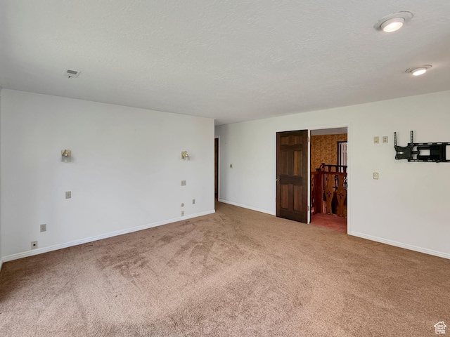 1145 E 1675 N, North Ogden, UT 84404 - empty room featuring carpet flooring, a textured ceiling, and baseboards