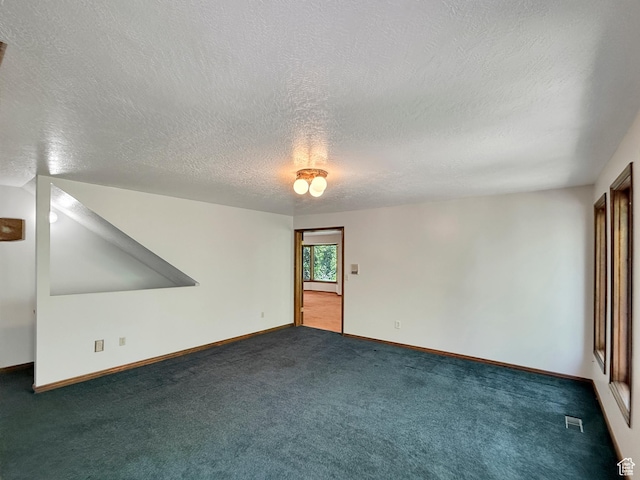 1145 E 1675 N, North Ogden, UT 84404 - unfurnished room featuring dark carpet, a textured ceiling, and baseboards
