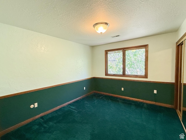 1145 E 1675 N, North Ogden, UT 84404 - unfurnished room featuring carpet flooring, a textured ceiling, and baseboards
