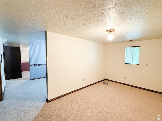 1145 E 1675 N, North Ogden, UT 84404 - spare room featuring light carpet, a textured ceiling, and baseboards