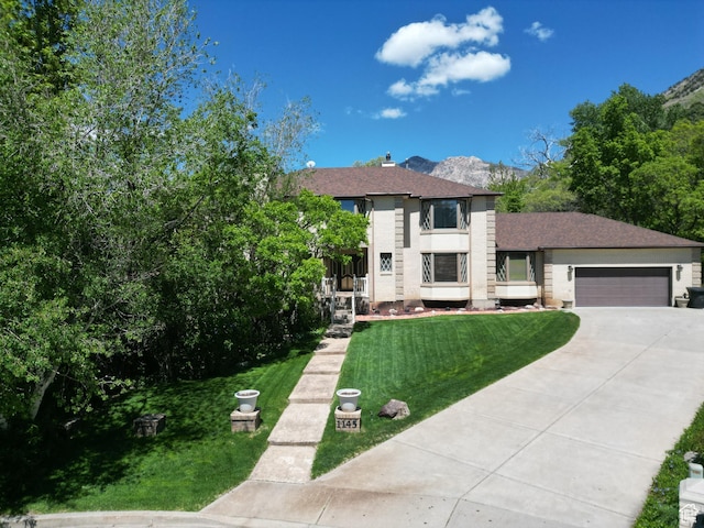 1145 E 1675 N, North Ogden, UT 84404 - view of front of property with concrete driveway, a garage, and a front yard