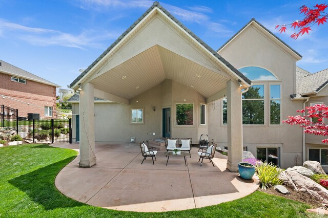 1161 Woodcrest Ln, North Salt Lake, UT 84054 - rear view of property with stucco siding, an outdoor hangout area, and a patio area