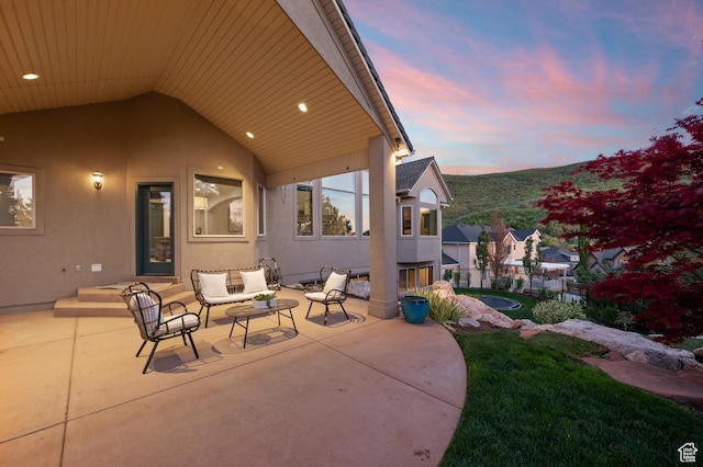 1161 Woodcrest Ln, North Salt Lake, UT 84054 - patio terrace at dusk with an outdoor living space