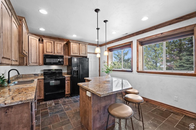 1161 Woodcrest Ln, North Salt Lake, UT 84054 - kitchen with black appliances, a sink, a kitchen breakfast bar, a kitchen island, and light stone counters