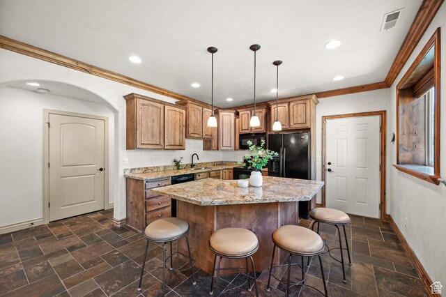1161 Woodcrest Ln, North Salt Lake, UT 84054 - kitchen featuring baseboards, a kitchen bar, crown molding, a kitchen island, and a sink