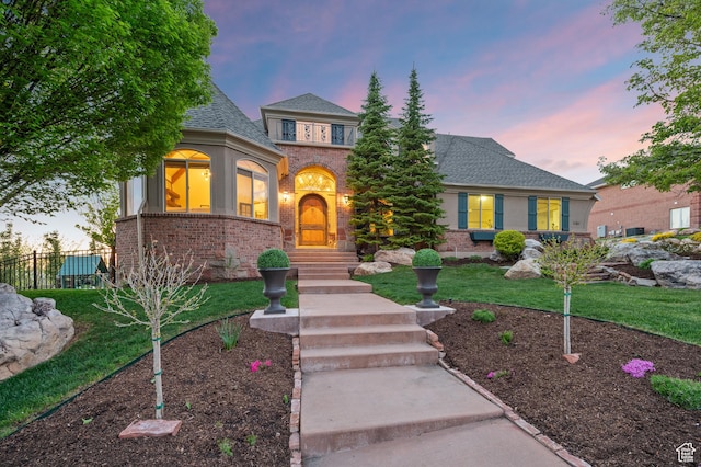 1161 Woodcrest Ln, North Salt Lake, UT 84054 - view of front facade with brick siding and roof with shingles