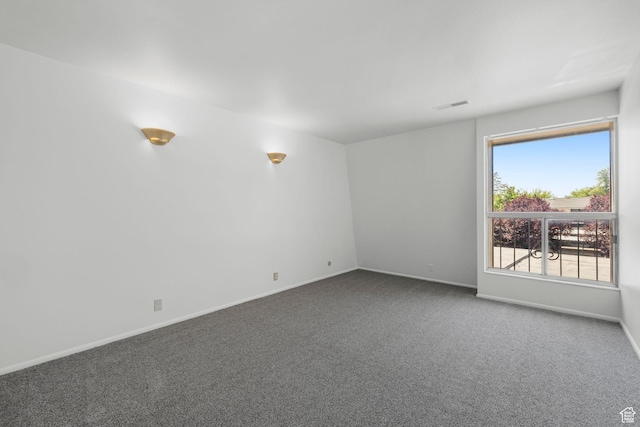 4878 S Highland Cir Unit 6, Salt Lake City, UT 84117 - unfurnished room featuring dark carpet and baseboards