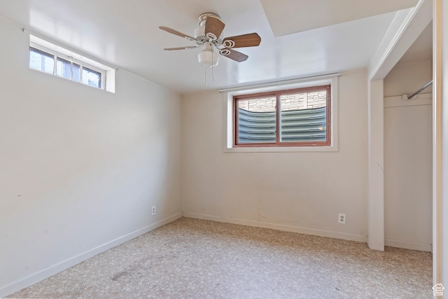 unfurnished bedroom with baseboards and ceiling fan
