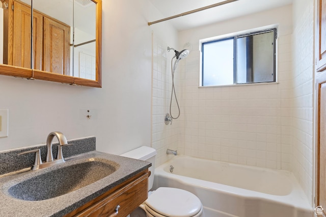 bathroom featuring toilet, shower / bath combination, and vanity