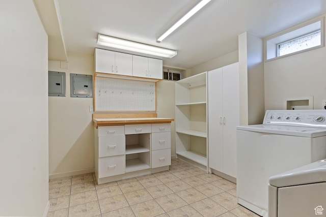 laundry room with washer / clothes dryer, electric panel, baseboards, and light tile patterned floors